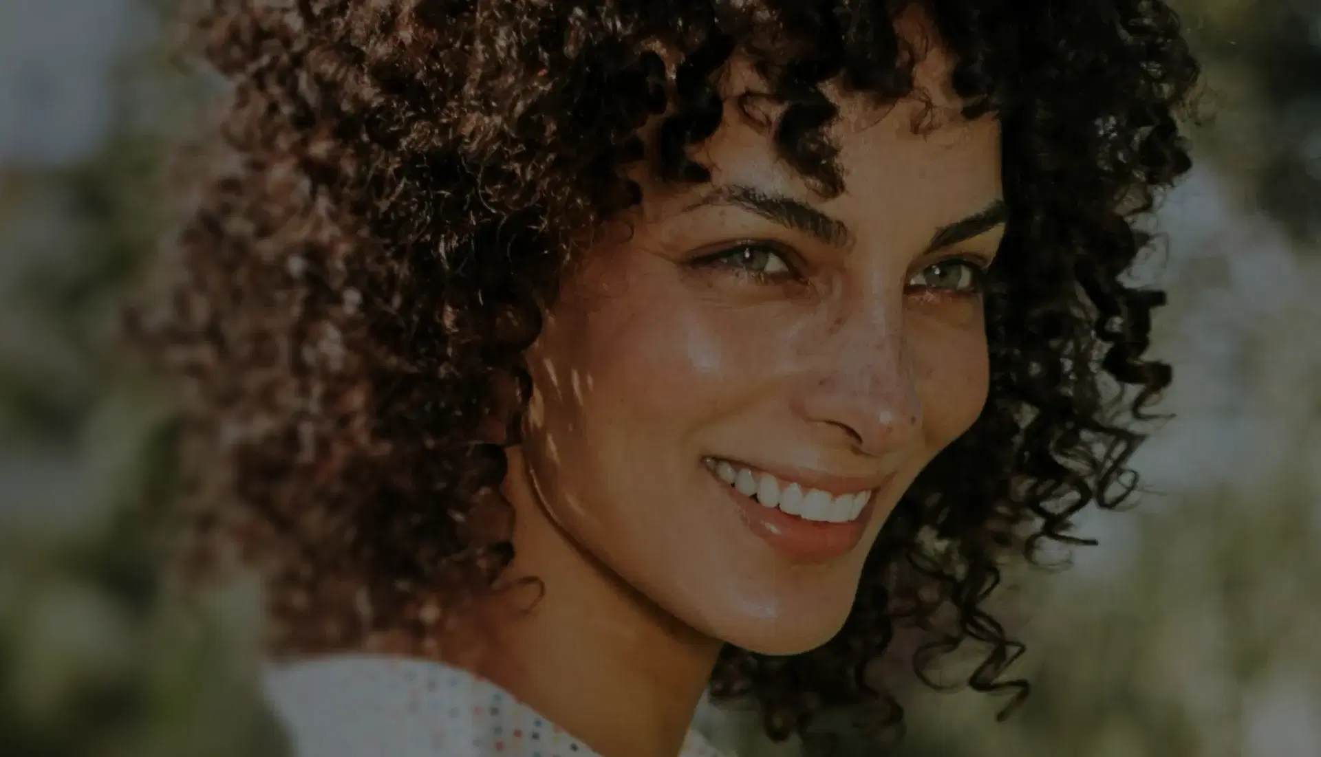 Woman smiling outdoors